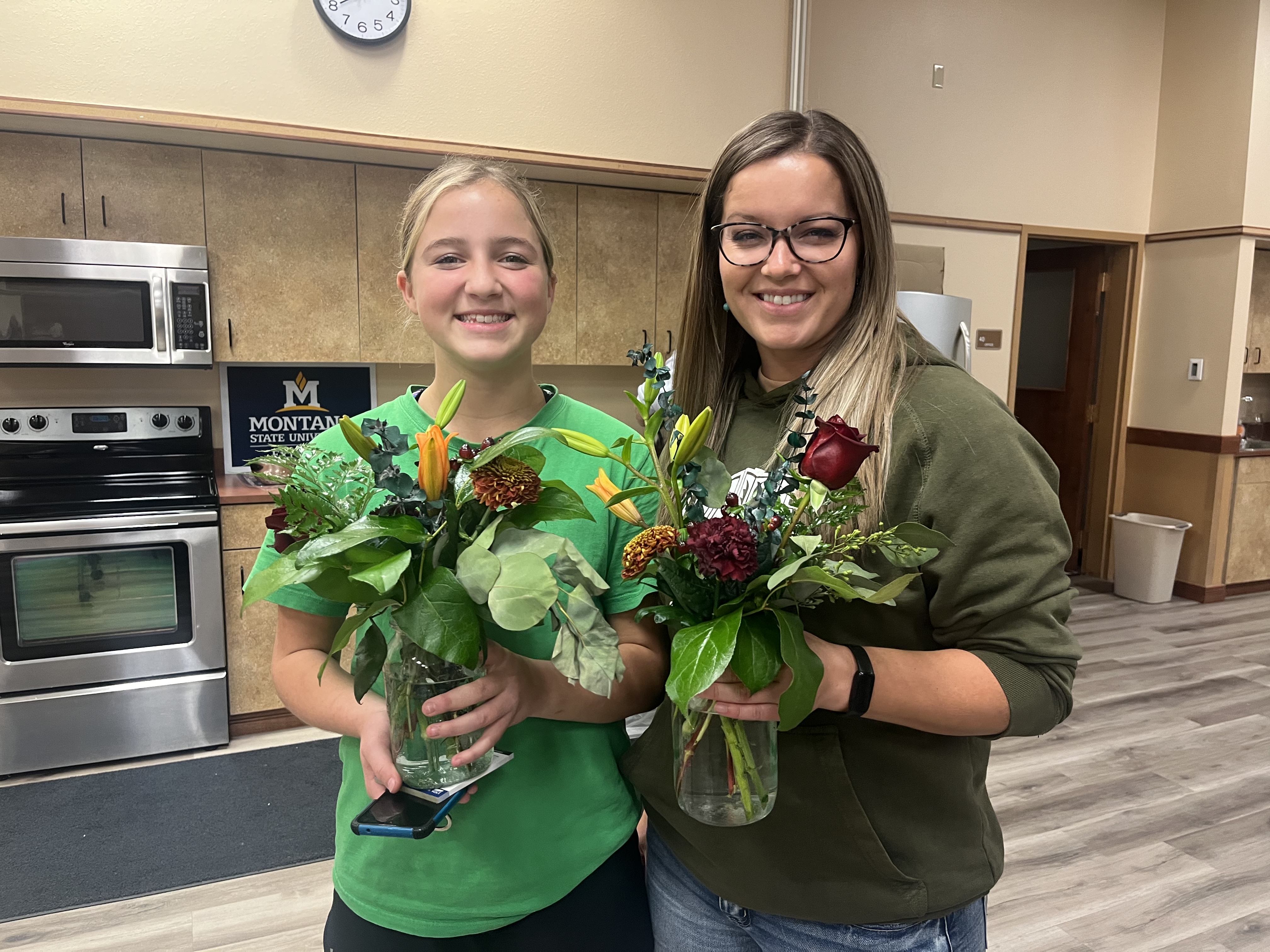 Women’s Night attendees participate in agriculture related learning and a floral arranging activity.